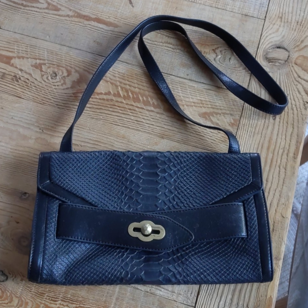 Pour la Victoire black snakeskin crossbody bag.